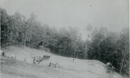 1933 – Winthrop Shaw (12 years old) on tractor, preparing soil to plant corn.