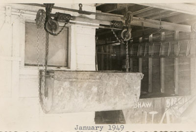 Louden Co. Manure Trolley – Manufactured by Louden Manufacturing of Fairfield, Iowa, the installation of a Louden “Litter Carrier” made manure collection easier. Overhead trolleys of various types are still made by the company today.