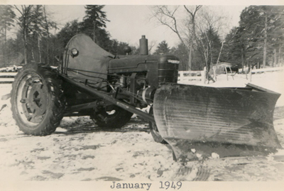 Farm-All H Tractor with winter modifications – We installed a windscreen and a plow blade on a frame to deal with the rough winter. Winter 1949