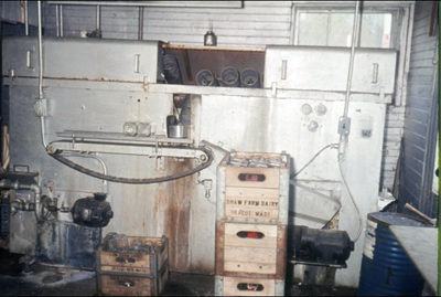 Milk Bottle Washer – In our milk processing plant, this machine washes returned glass milk bottles. 1952