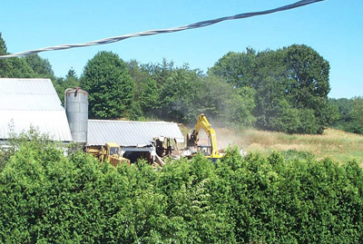 July 2002 – In the summer of 2002, we tore down the shed attached to the old barn, to make room for the construction of the new barn addition.