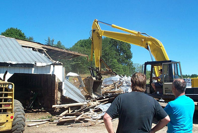 Warren, and lifetime friend, Charlie Kleczkowski, watch on as the shed is demolished. Summer 2002.